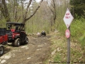 Cutting back the brush and hauling stone.