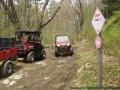 Cutting back the brush and hauling stone.